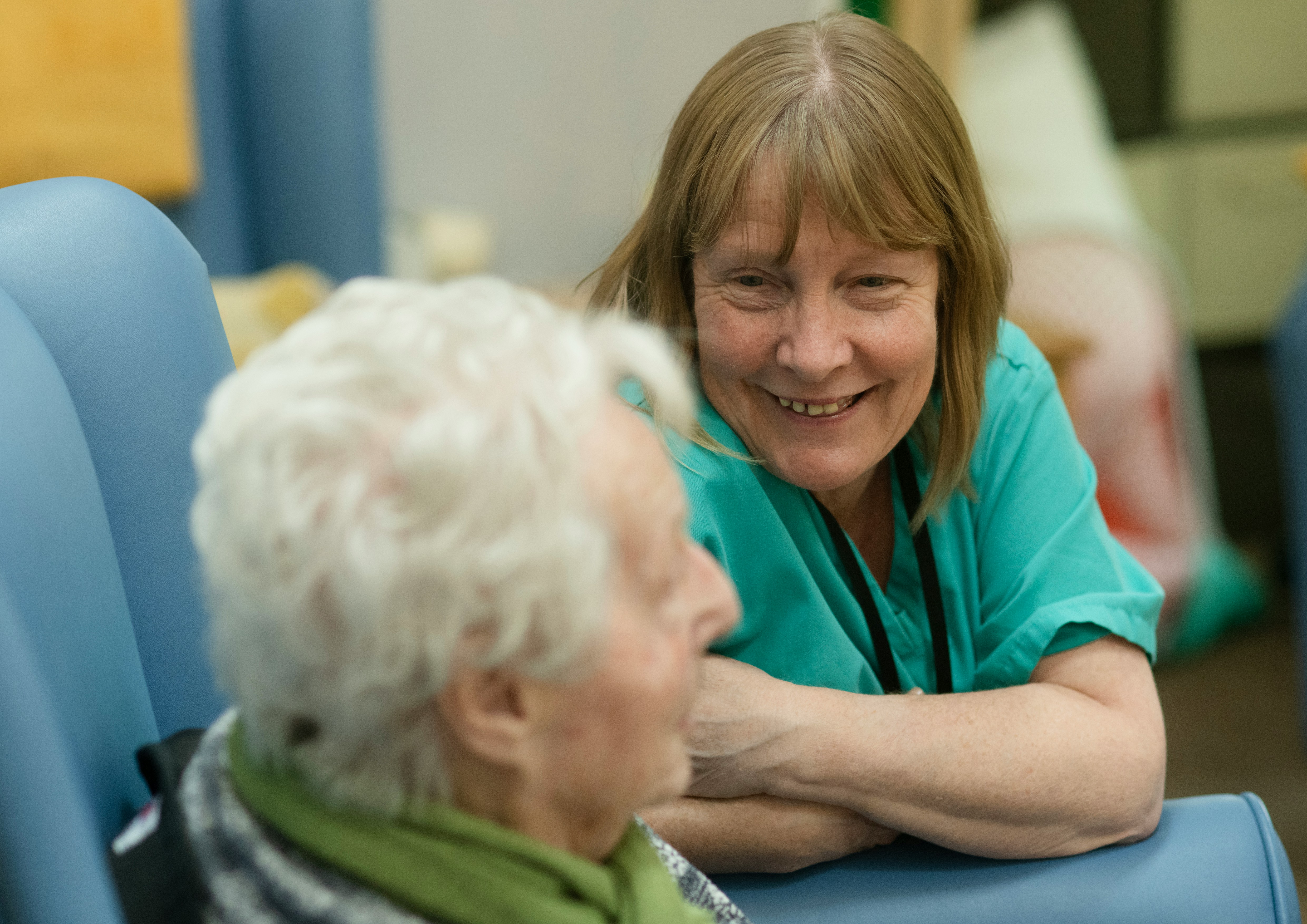 A carer supporting an older person